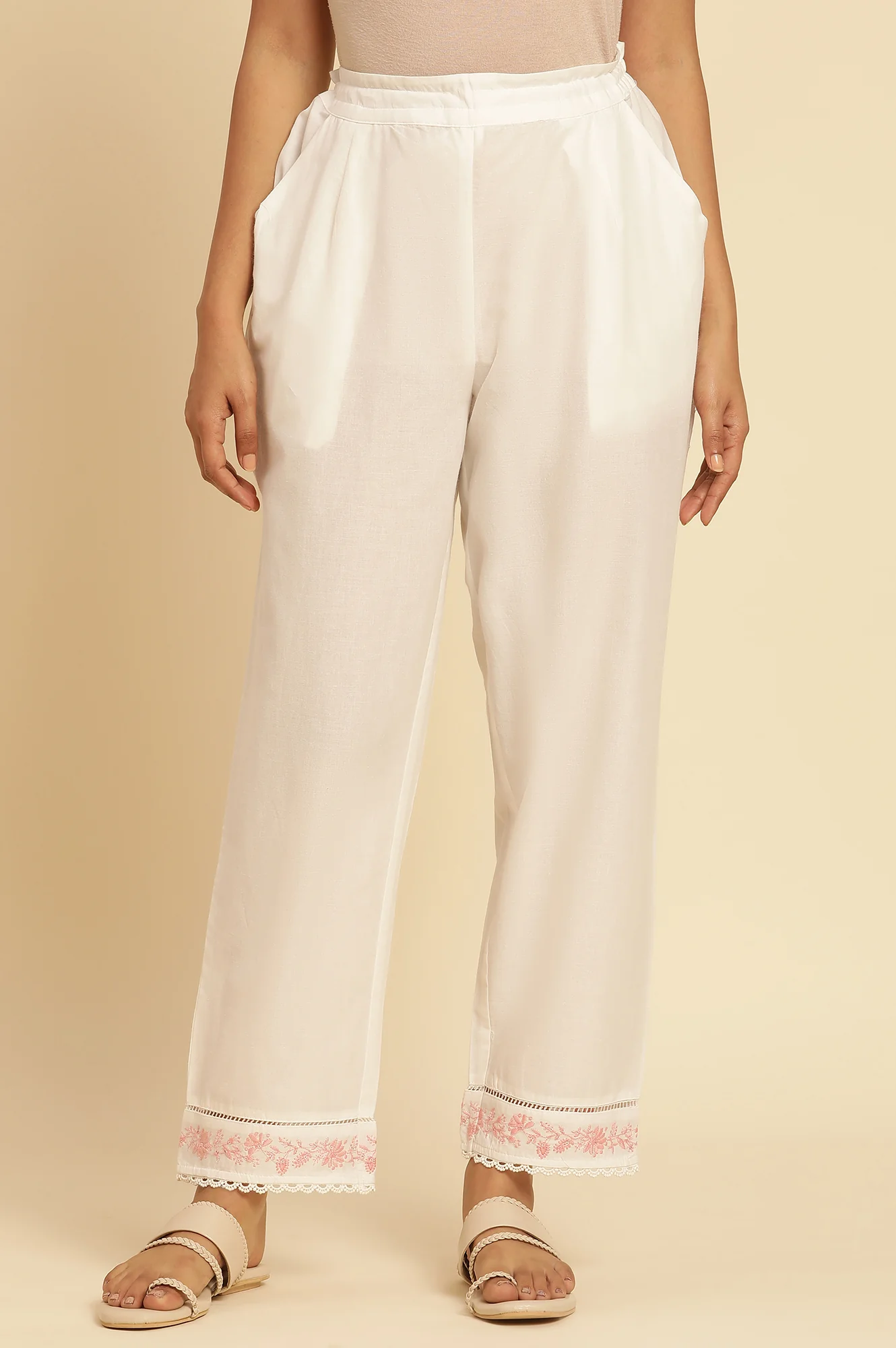 Ecru Solid Straight Pants With Embroidered Hemline