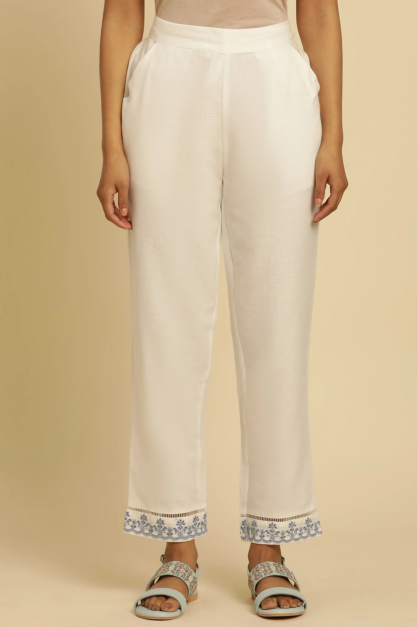 Ecru Solid Straight Pants With Embroidered Hemline